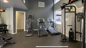 Fitness center with treadmills and weight equipment